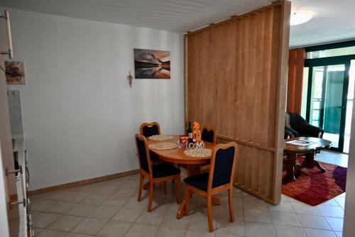 a dining room with a table and chairs at Marie in Krk