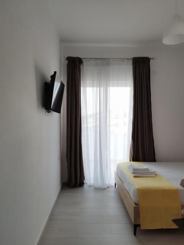 TV a/nebo společenská místnost v ubytování Iris Apartments Ksamil