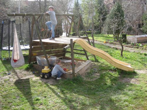 a child playing in a sandbox on a playground at Ferienwohnung Im Bürgermeisterhaus in Bad Langensalza