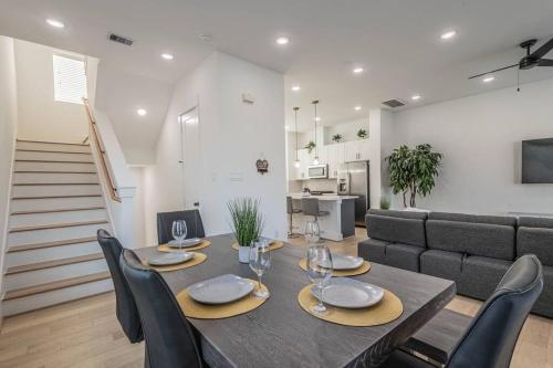 a dining room with a table and a couch at Your home away from home in Houston
