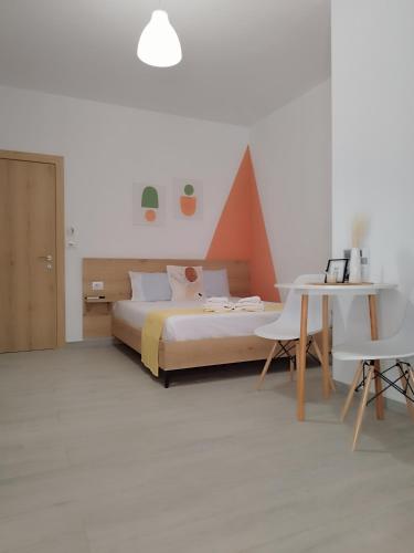 Postel nebo postele na pokoji v ubytování Iris Apartments Ksamil