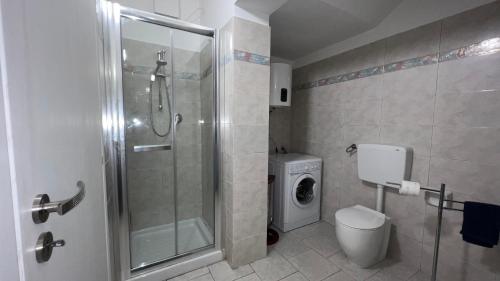a bathroom with a shower stall and a toilet at Casa di Mery in Massa Lombarda