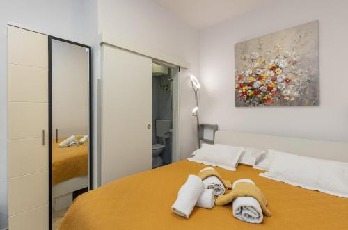 Posteľ alebo postele v izbe v ubytovaní Guest House Tomasi