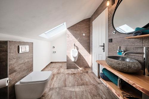 a bathroom with a sink and a mirror at Anhalt Pension in Coswig