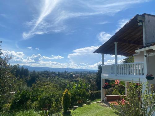 a house with a view of the mountains at Casa de campo Jade, Rionegro in Rionegro