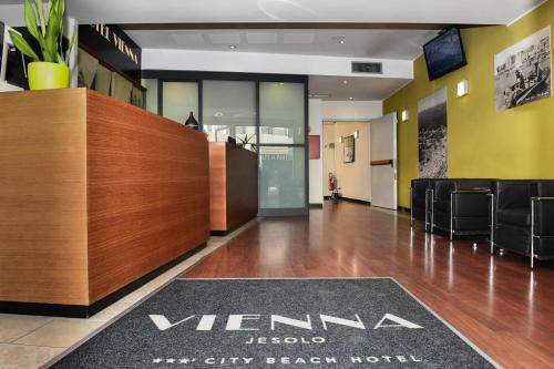 a lobby with a vernania sign on the floor at Hotel Vienna in Lido di Jesolo