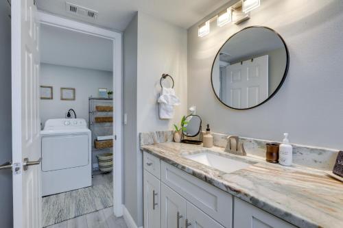 a bathroom with a sink and a mirror at Coastal Sarasota Condo Minutes to Beach! in Sarasota