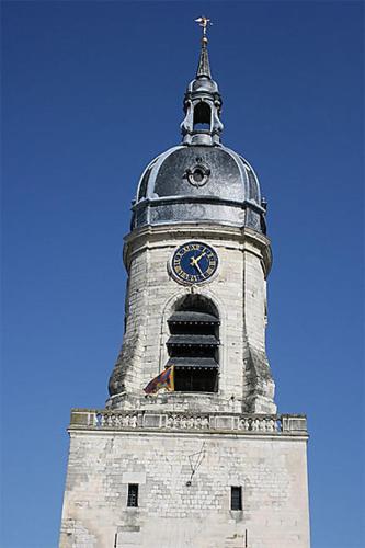 a tall tower with a clock on top of it at Maison stACHEUL*gare/centre*wifi in Amiens
