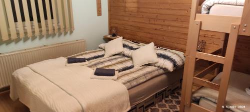Postel nebo postele na pokoji v ubytování Apartma Arh