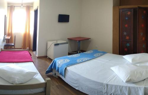 Ένα ή περισσότερα κρεβάτια σε δωμάτιο στο Hotel Pousada Icaraí
