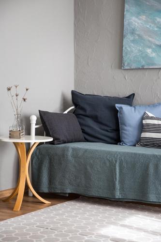 a living room with a couch and a table at Ferienwohnung am Sonnenberg in Busingen am Hochrhein