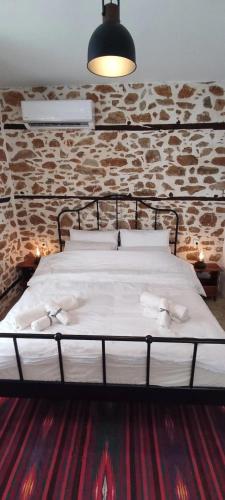 Ένα ή περισσότερα κρεβάτια σε δωμάτιο στο San Lorenzo Cottage - Παραδοσιακά Πέτρινα Δωμάτια