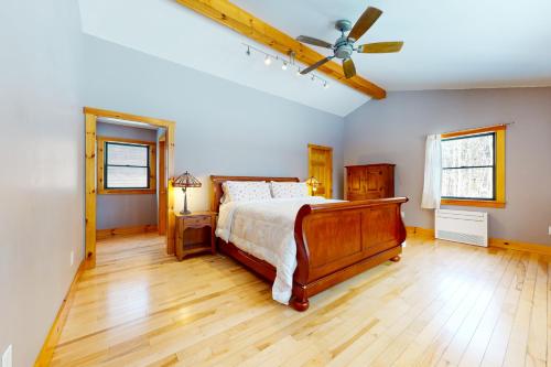 a bedroom with a bed and a ceiling fan at Chester Charmer in Chester
