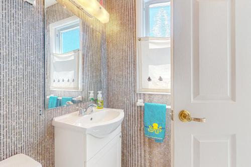 a bathroom with a sink and a mirror at Town of South Bethany --- 5 Surfside St in Bethany Beach