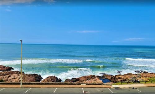 a view of the ocean from a parking lot at Santorini Unit RR in Margate