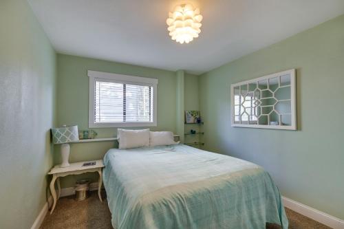 a bedroom with a bed and a desk and a window at Coastal Tillamook Vacation Rental Ocean Views! in Tillamook