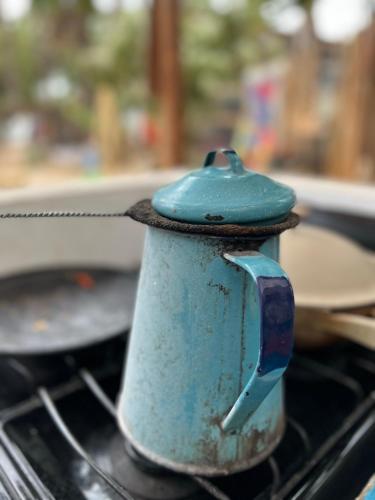 a blue tea pot sitting on top of a stove at La Sardina in Todos Santos
