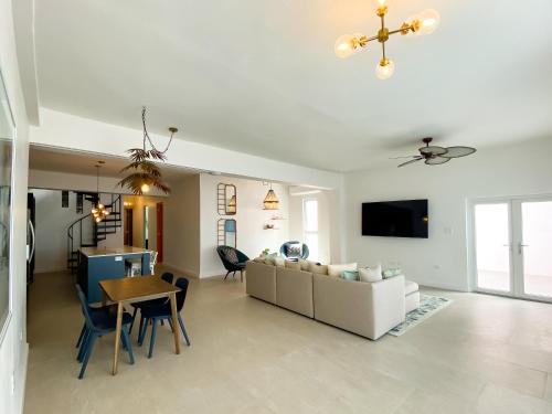 a living room with a couch and a table at N1 Condos in San Juan