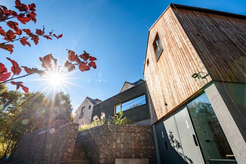 a building with the sun in the sky at 4 DOMY in Dolní Morava