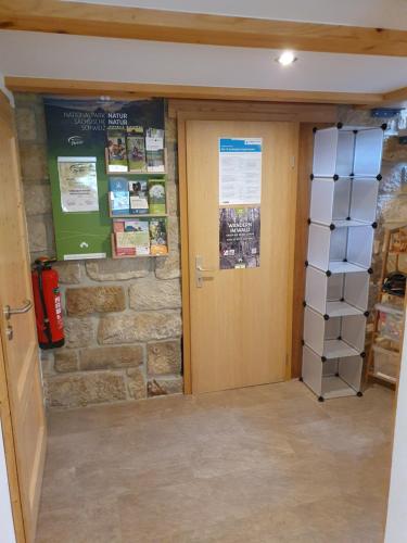 a room with a door and a stack of boxes at Ferienhaus Bildhauer Thiele in Ottendorf