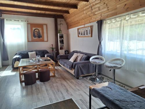 a living room with a couch and a table at Stay Wild in Žabljak