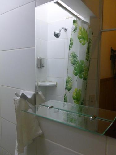 a bathroom with a glass sink and a shower at La Casona Azul in Lima