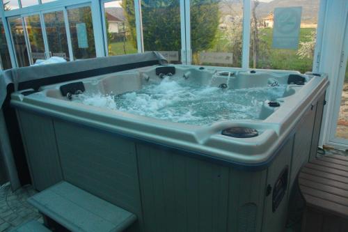 a large tub with water in it in a yard at Hotel Doña Jimena in Villarcayo