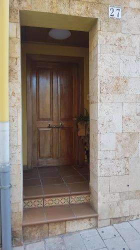 a entrance to a house with a wooden door at Casa Maite in Palamós