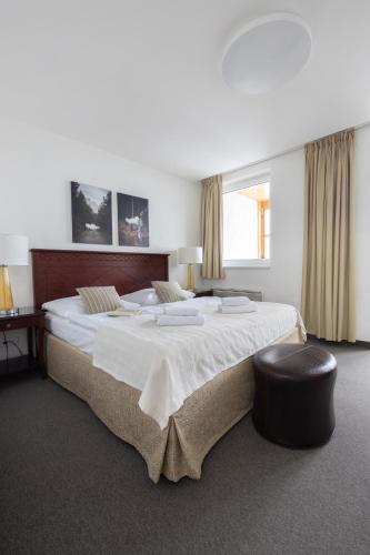 Postel nebo postele na pokoji v ubytování Hotel Petrovy kameny