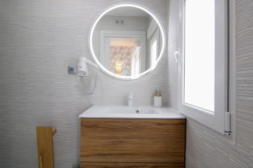 a bathroom with a sink and a mirror at La Lagunilla Golf in Candeleda