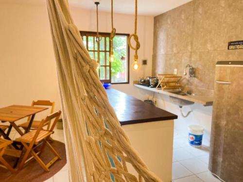 a kitchen with a net in the middle of it at Casa Mar in Praia do Forte