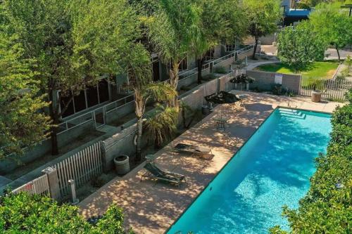 an overhead view of a swimming pool with trees at Tempe Lofty Studios in Tempe