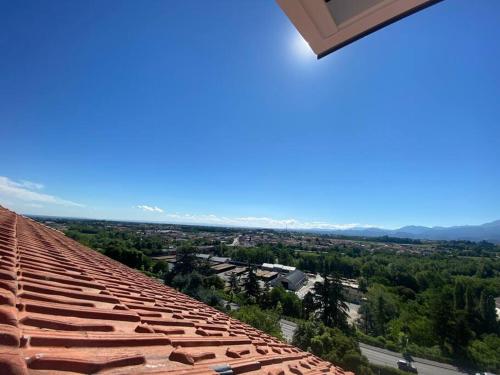 a view from the edge of a tile roof at Deliziosa mansarda con vista panoramica in Cuneo