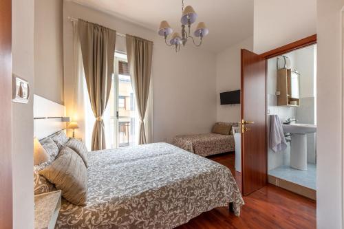 Postel nebo postele na pokoji v ubytování B&B della Stazione