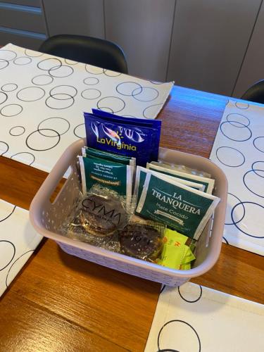 a lunch box with donuts and pamphlets on a table at TERRAZAS DEL TAFI in Tafí del Valle