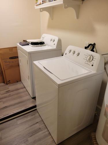 a white washer and dryer in a room at Large Spacious Bedroom with Private Entrance Females Only in Westwego