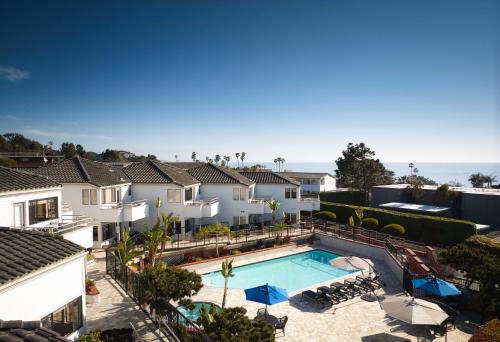 an aerial view of a villa with a swimming pool and houses at Hotel Indigo San Diego Del Mar, an IHG Hotel in San Diego