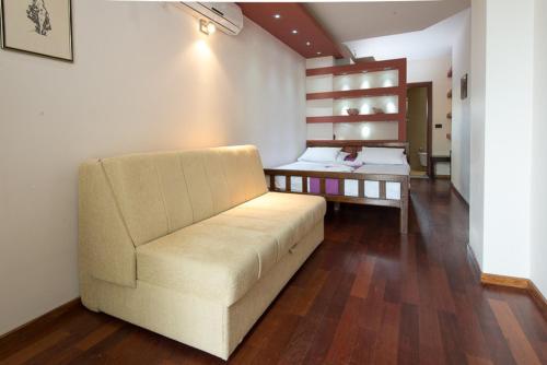 a living room with a couch and a table at Vila Centar in Budva
