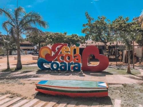 a large sign that says calocalocalocalaza in a park at casa jasmin in Jericoacoara