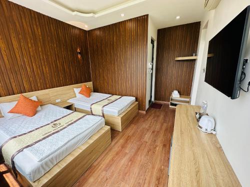 Ein Bett oder Betten in einem Zimmer der Unterkunft Minh Hoang Hotel & Homestay