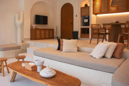 a living room with a couch and a table at Villa Soll A By The Villas 100 in Bogor