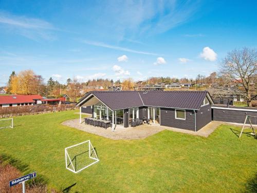 a house with a soccer ball in the yard at Tranquil Retreat near Beach - By Traum Ferienwohnungen in Vejle