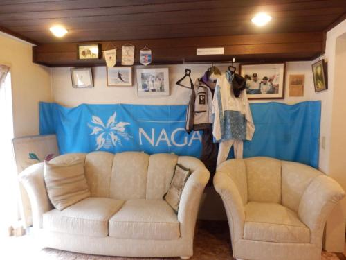 two couches in front of a ncaa room at Hotel Weisser Hof Happei in Hakuba