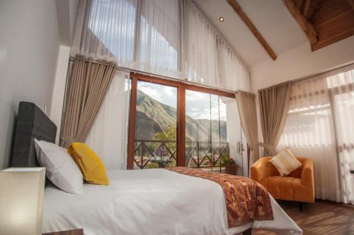 a bedroom with a bed and a large window at Flores de la Villa in Huayoccare