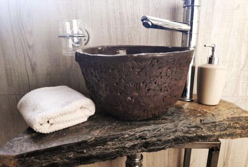 a bathroom sink sitting on top of a counter at הבית החום בערבה in Sappir