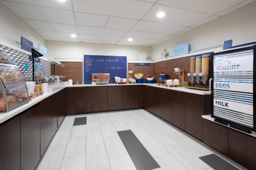 a restaurant with a counter in a store at Holiday Inn Express & Suites Tucson by IHG in Tucson