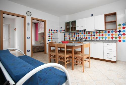 Kuchyň nebo kuchyňský kout v ubytování Residence La Pigna