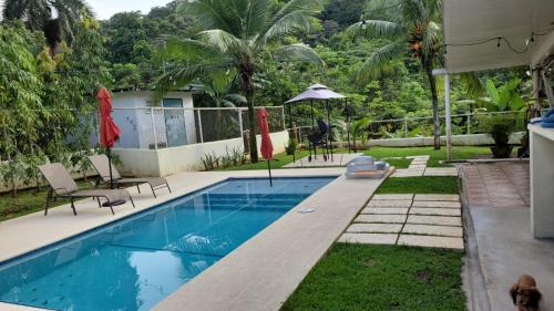 a swimming pool in the backyard of a house at oasis with pool near Panama Canal in Panama City