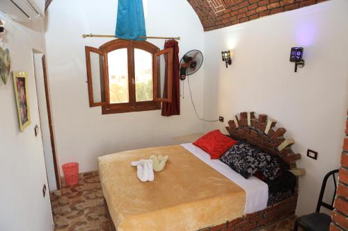 Postel nebo postele na pokoji v ubytování Memnoun house