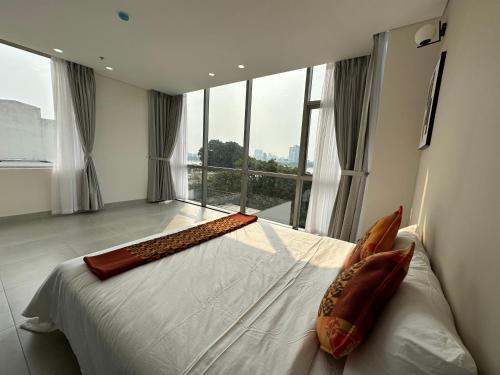 Ein Bett oder Betten in einem Zimmer der Unterkunft Khe Suites Serviced Apartment - Han River